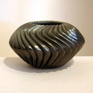 Carved spiral melon black jar
