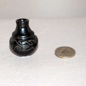 Geometric design on a black and white miniature water jar