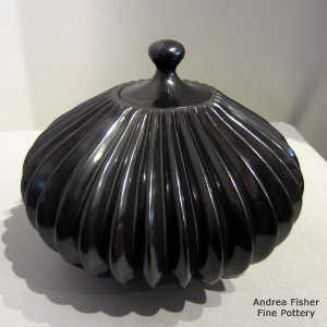 Carved black lidded melon jar