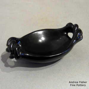 Twisted handles on a miniature black serving tray