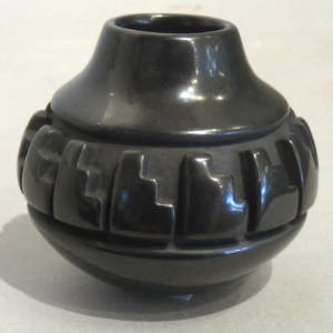 Kiva step design carved into a miniature black jar
