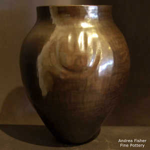Bear paw imprints on a burnished black jar
