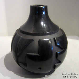 Kiva step geometric design carved into a black jar