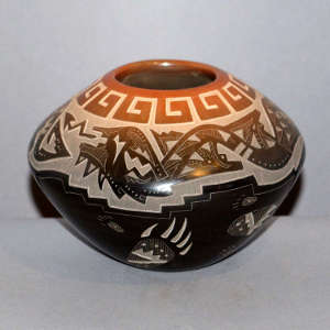 Sgraffito avanyu, bear paw and geometric design on a black jar with a sienna rim