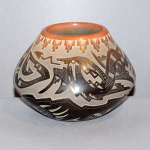 Sgraffito avanyu, bear paw and geometric design on a black jar with a sienna rim