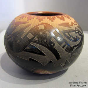Sgraffito avanyu and geometric design on a black jar with a sienna rim