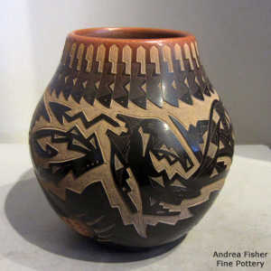 Sgraffito feather, avanyu, bear paw and geometric design on a black jar with a sienna rim