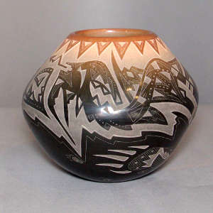 Sgraffito avanyu, feather and geometric design on a black jar with a sienna rim