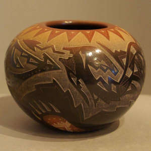 Sgraffito avanyu and traditional designs plus sienna rim and spots on a black jar