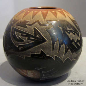Sgraffito avanyu, bear claw and geometric design on a polished black jar with sienna rim and spots