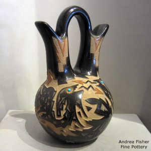 Sienna spots, inlaid turquoise and sgraffito avanyu and geometric design on a black wedding vase