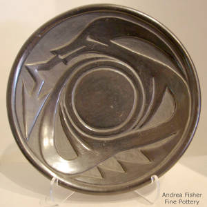 Avanyu design carved into a black plate
