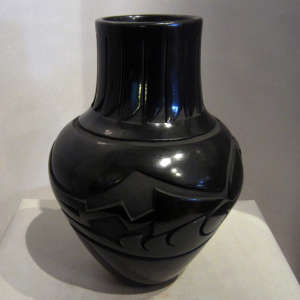 Geometric designs carved into a black jar