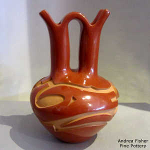 Avanyu design carved into a red wedding vase