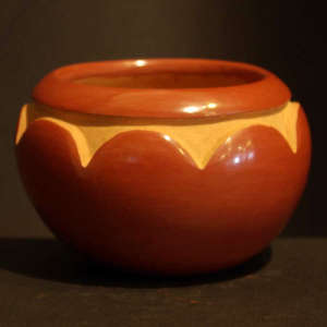 Cloud design carved into a red jar