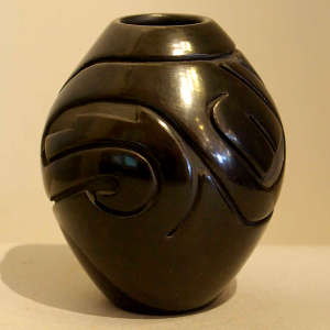 Geometric design carved into a black jar