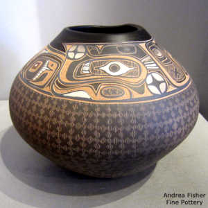 Band of sgraffito Northwest Coast design above the shoulder on a brown jar