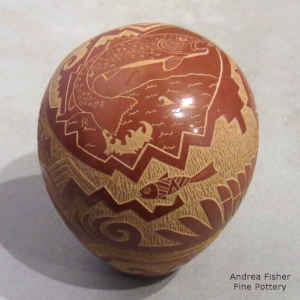 Sgraffito fish, water and geometric design on a miniature red seed pot