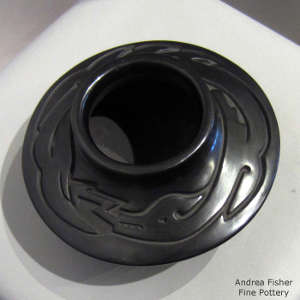 Avanyu design carved into a flat-topped polished black jar