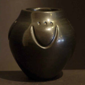 Bear paw imprint on a polished black jar