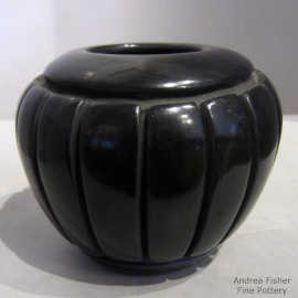 Black jar carved with a melon design