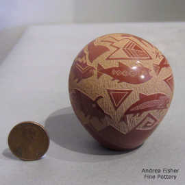 Sgraffito fish, water and geometric design on a miniature red seed pot