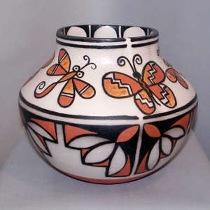 Butterfly and geometric design on a polychrome jar