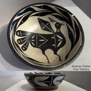 Geometric design outside and bird and branch design inside a polychrome bowl