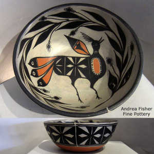 Geometric design outside and bird and plant design inside a polychrome bowl