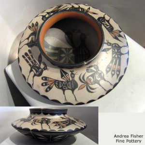 Bird design inside and bird and geometric design outside on a polychrome low shoulder jar