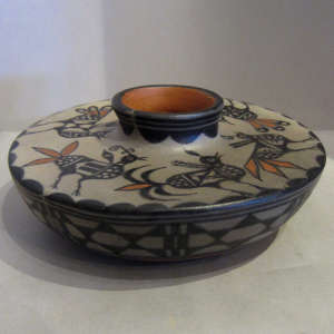 Bird and geometric designs on a flat-topped polychrome jar