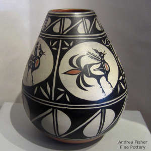 Bird and geometric design on a polychrome jar