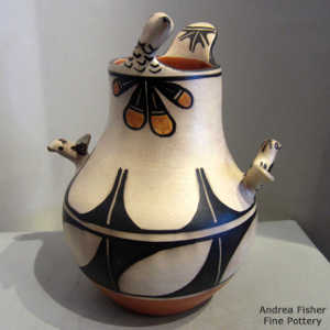 Feather and geometric design on a polychrome jar with raised birds