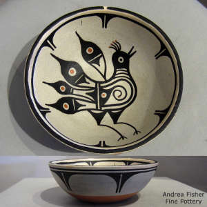 Bird and geometric design inside, geometric design outside on a polychrome bowl