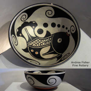 Fish and geometric design inside, geometric design outside on a polychrome bowl