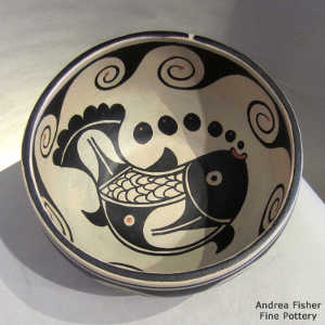 Fish and geometric design inside and geometric design outside on a polychrome chile bowl
