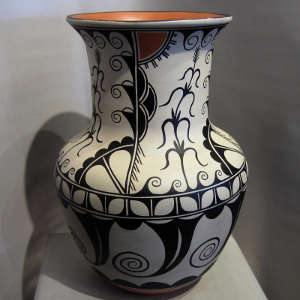 Corn, cotton and water design on a polychrome umbrella stand