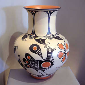 Floral, bird and geometric design on a polychrome jar