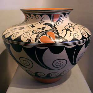Cloud, rain, corn plant and geometric design on a large polychrome jar