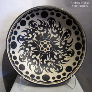 Geometric design inside and out on a polychrome plate