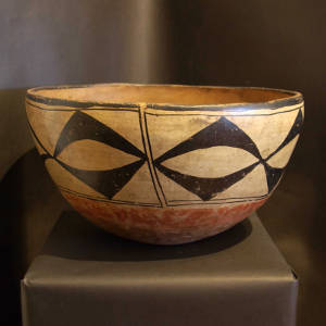 Geometric design on the outside of a large polychrome dough bowl