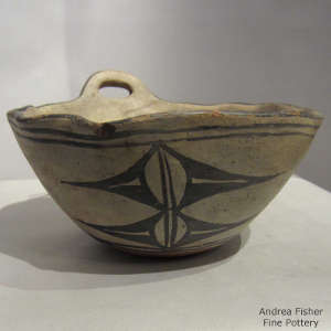 Geometric design and faceted rim on a polychrome bowl
