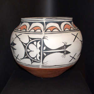 Birds, clouds and geometric design on a polychrome storage jar