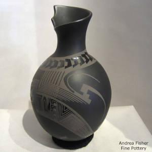 Black on black on black vase with an organic opening and Paquime designs, Click to see a larger version An organicopening and Paquime designs on a black on black on black vase