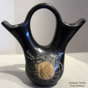 Black wedding vase with sgraffito hummingbird design on one side and sgraffito butterfly design on the other, Click to see a larger version Sgraffito medallions on the body of a black wedding vase
