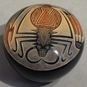 Black seed pot with sienna spots and sgraffito Mimbres scorpion design Sgraffito Mimbres scorpion design on a black seed pot