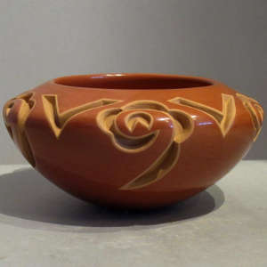 Red bowl carved with a four direction geometric design, Click to see a larger version A geometric design carved into a red bowl