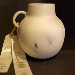 Fire clouds on a white cup with a handle