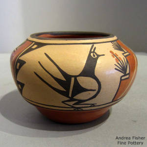 Bird and geometric design on a polychrome jar