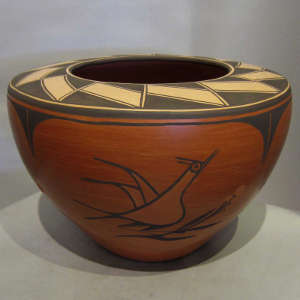 Bird and geometric designs on a polychrome flat-topped jar